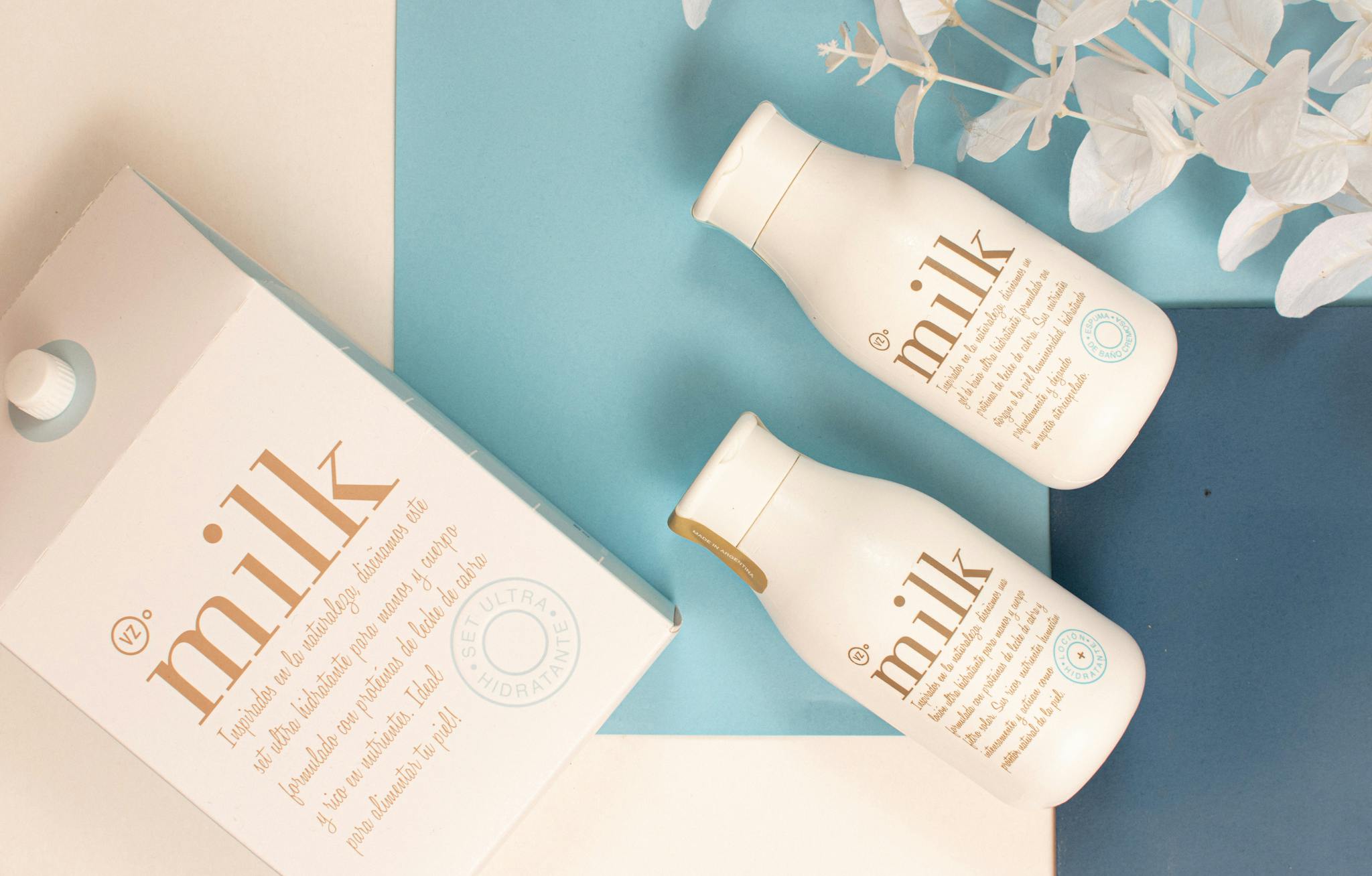 Elegant flat lay with milk-themed skincare, perfect for health and beauty.